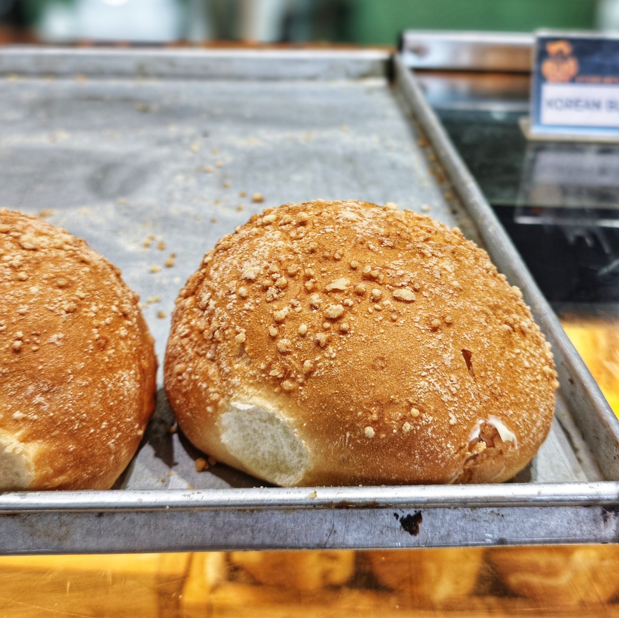 Golden bread rolls with a crumb-dusted crust.