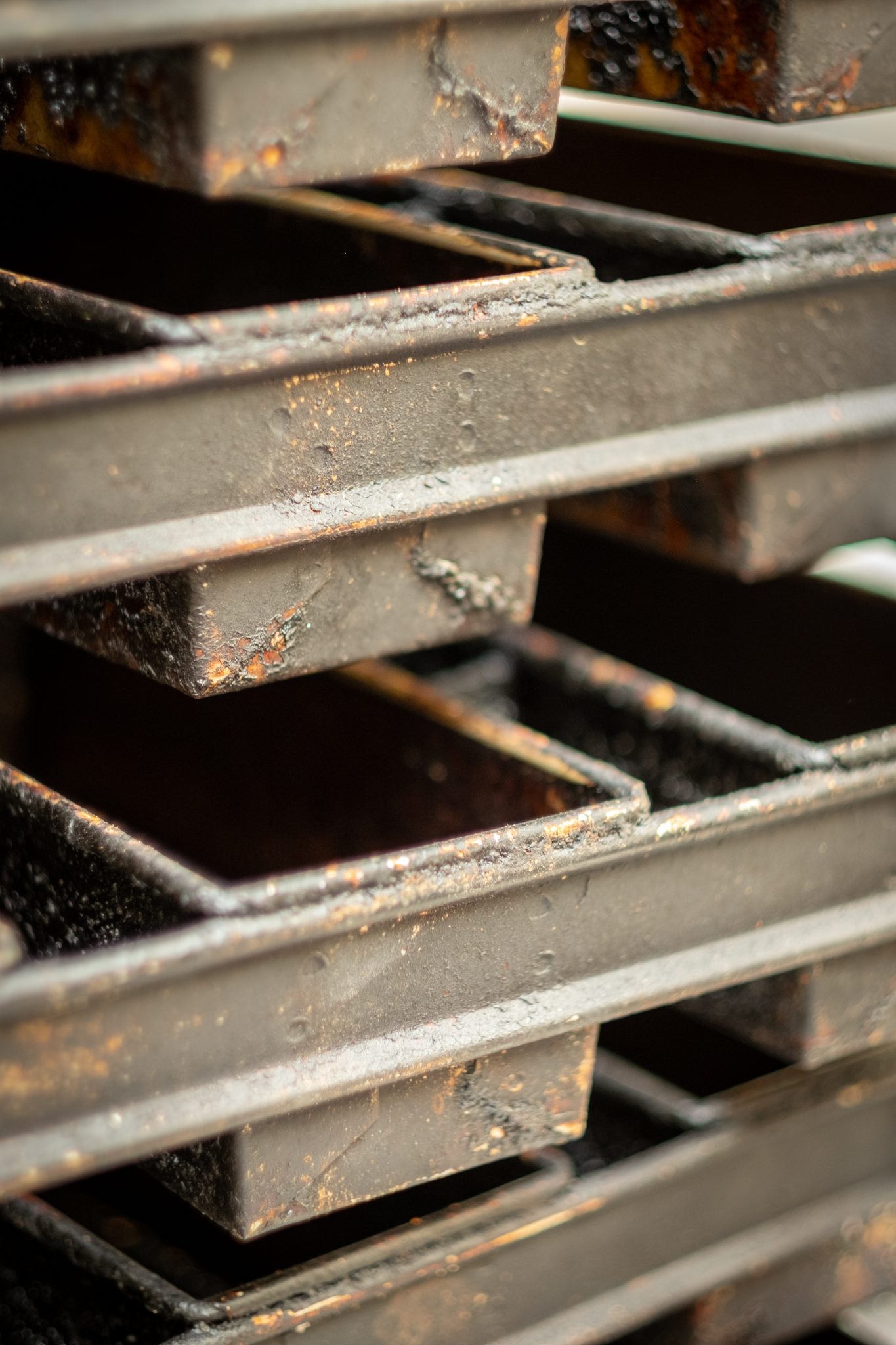 Stacked baking trays in a bakery.